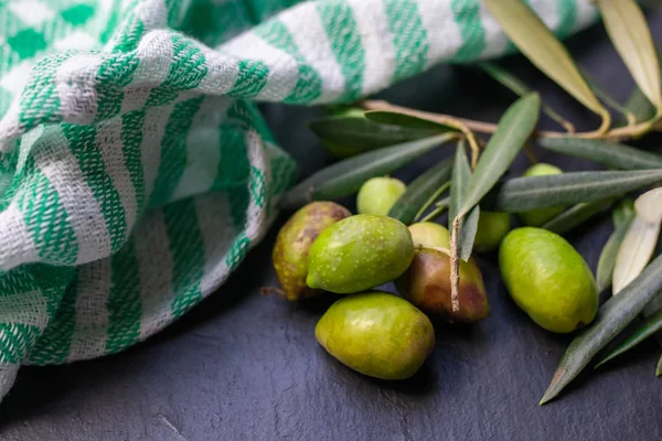 natural olives with olive leaves