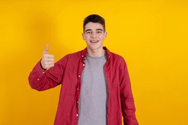young teenage man or student isolated on color background