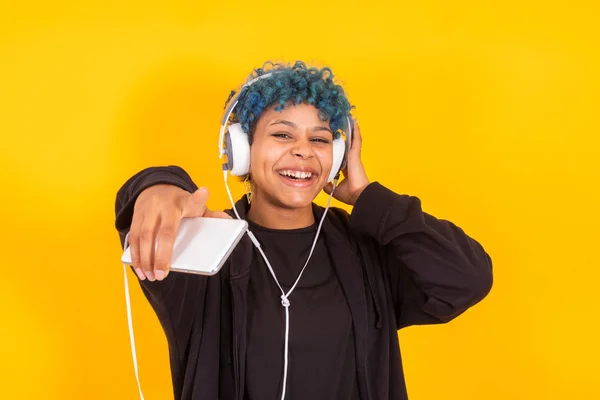 Young Afro American Girl Mobile Phone Headphones Dancing Isolated Yellow — 스톡 사진