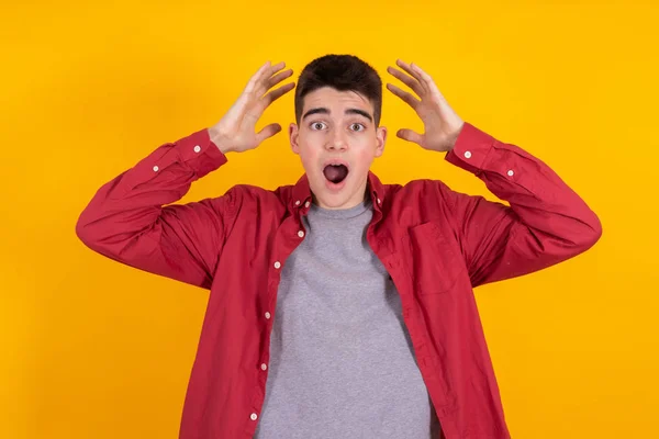 Young Man Teenage Student Astonishment Surprise Expression Isolated Yellow Background — Stok fotoğraf