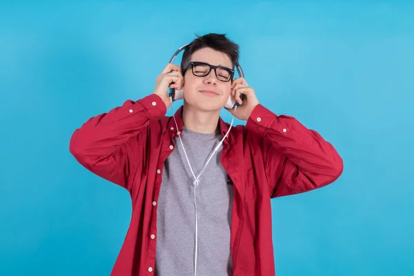 Young Teenage Man Headphones Isolated Blue Background — Stock Photo, Image