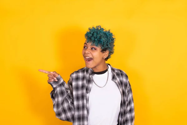 Young African American Woman Blue Curly Hair Pointing Yellow Background — Stock Photo, Image