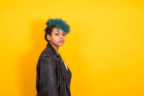 portrait of young afro american woman isolated on color background