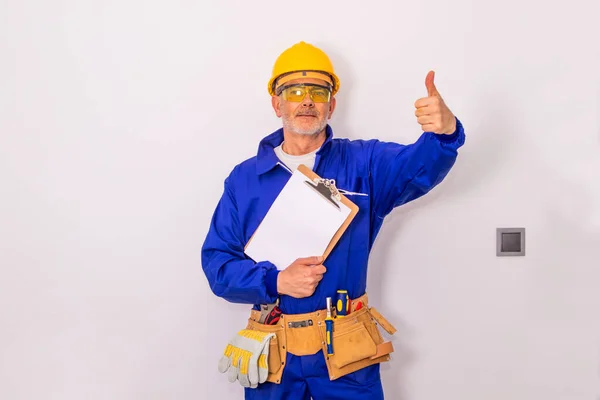 construction worker or professional man with tools and helmet