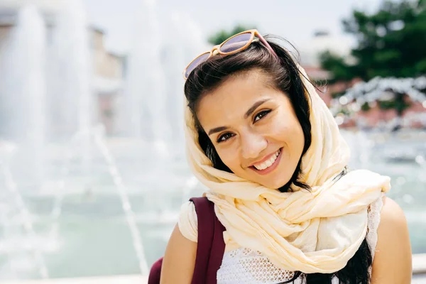 Close-up portrait of a young Muslim woman in a scarf and glasses. — Stock Photo, Image