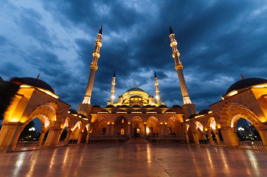 majestic beautiful Muslim mosque under the night sky clipart