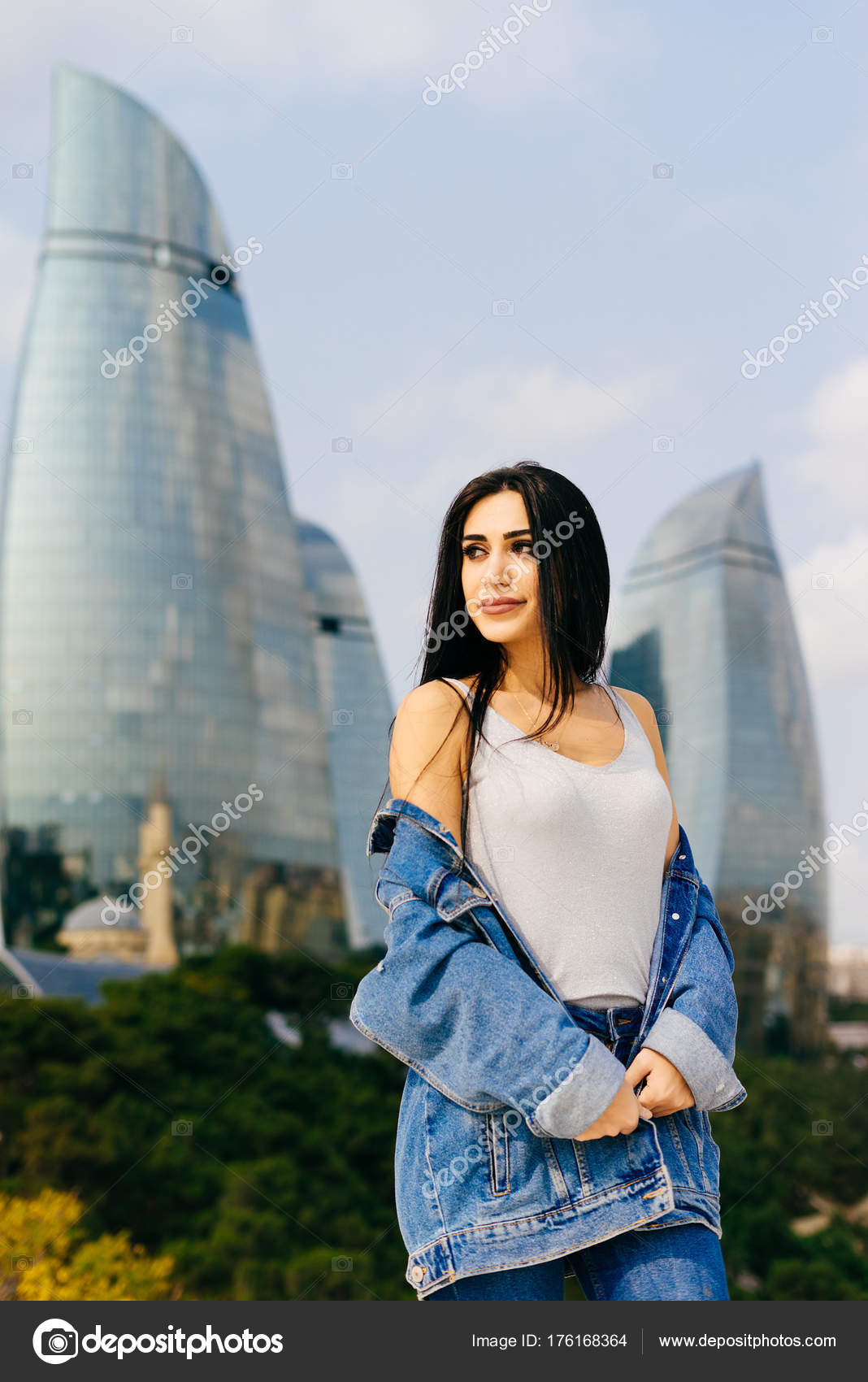 beautiful black-haired girl travels through Europe, poses ...