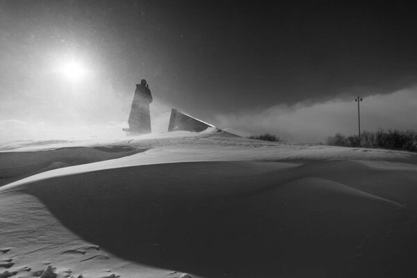 winter weather, a military monument skidded with snow, everywhere white drifts