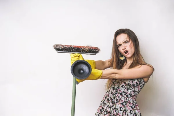 Emotional happy cleaning woman with mop and plunger — Stock Photo, Image