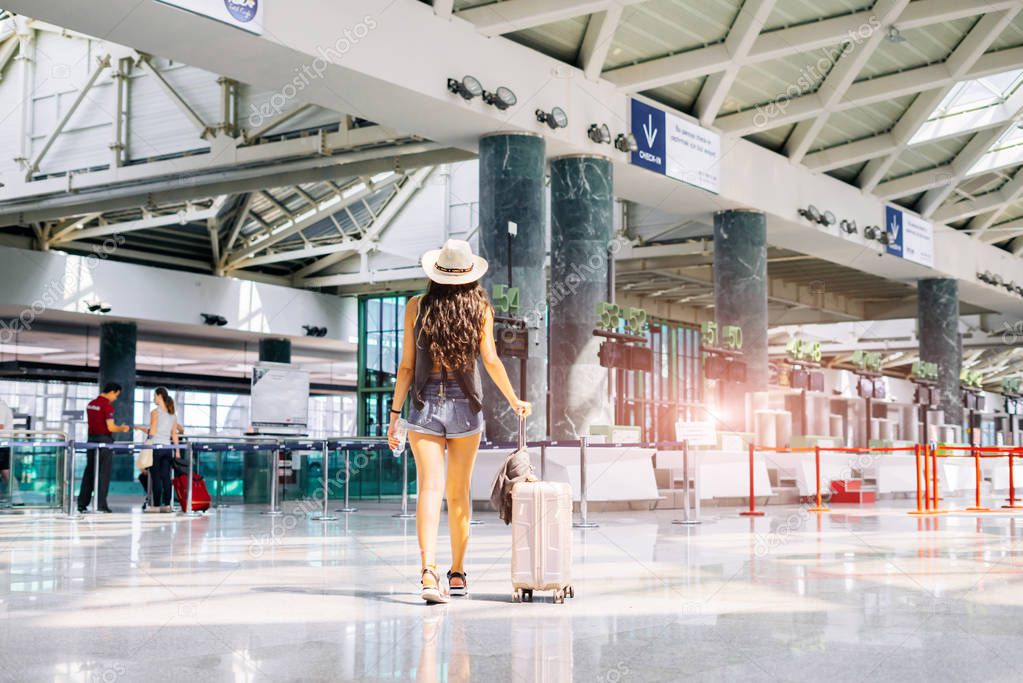 Woman go to gates in airport, security checking