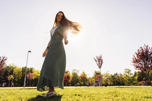 Woman joyful and happy in a park,summer,shining sun