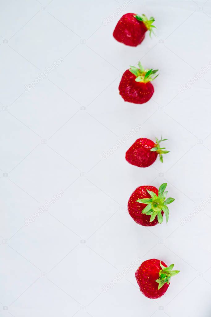 Fresh raw healthy diet strawberries fruit in plate,isolated on white,view above,flatlay close-up,copyspace for text,frame