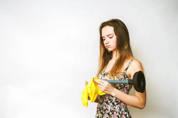 Woman with plunger ,cleaning on a white background — Stock Photo, Image