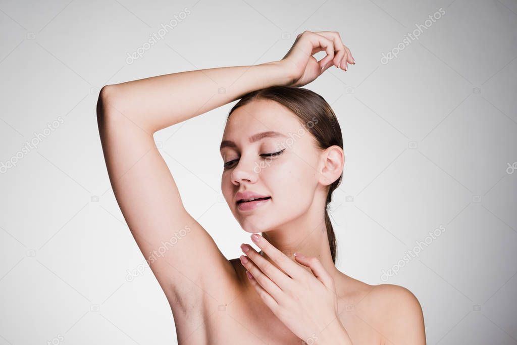 cute beautiful girl showing her armpits without hair
