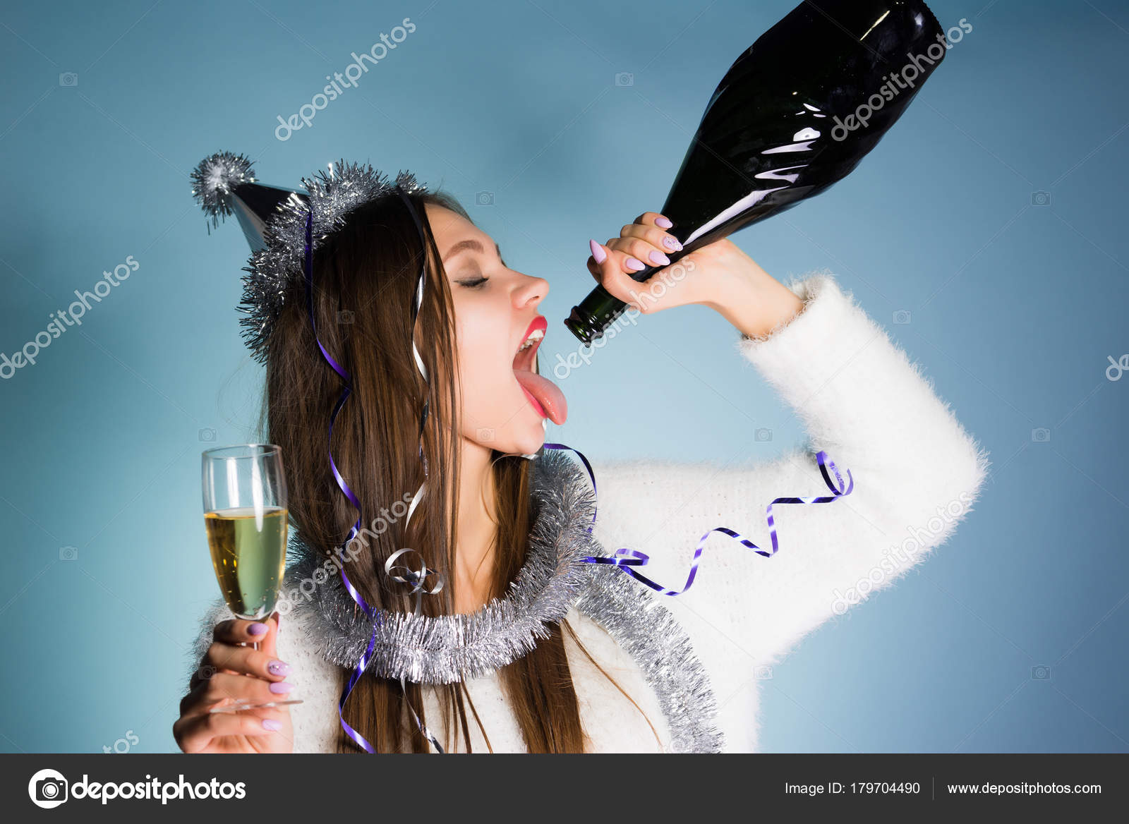 Funny young drunk girl celebrates a new year alone, drinks champagne from a bottle Stock Photo by ©mne_len 179704490 Funny young drunk girl celebrates a new year alone, drinks champagne from a bottle Stock Photo by ©mne_len 179704490