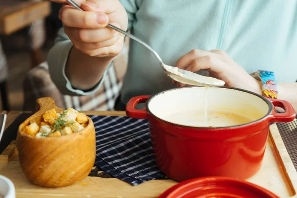 The girl is having a delicious hot soup in the cafe — Stock Image The girl is having a delicious hot soup in the cafe Royalty Free Stock Images