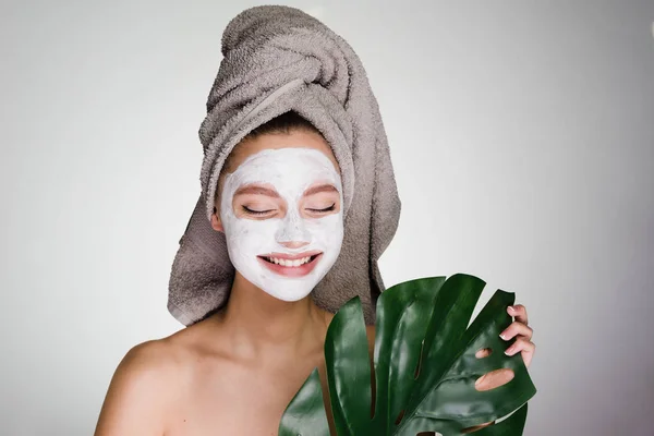 The happy girl has put or rendered a clearing mask on the face — Stock Photo, Image