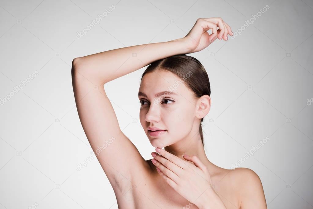 woman on white enjoying her smooth skin