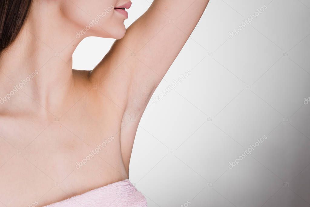 woman on white background enjoying her smooth skin