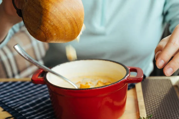 Girl in a blue sweatshirt at a cafe with hot aromatic soup — Stock Image Girl in a blue sweatshirt at a cafe with hot aromatic soup Royalty Free Stock Images