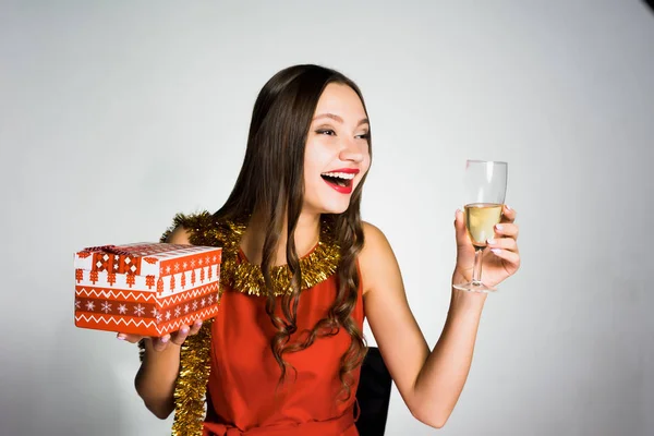 Happy drunk woman holding a glass of champagne in her hand — Stock Photo, Image