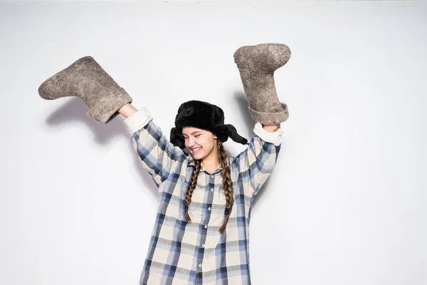 Happy russian woman with felt boots on hands — Stock Photo, Image