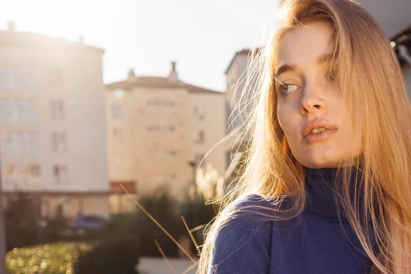 Young beautiful pensive model blonde girl enjoying the warm spring weather and sun — Stock Photo, Image