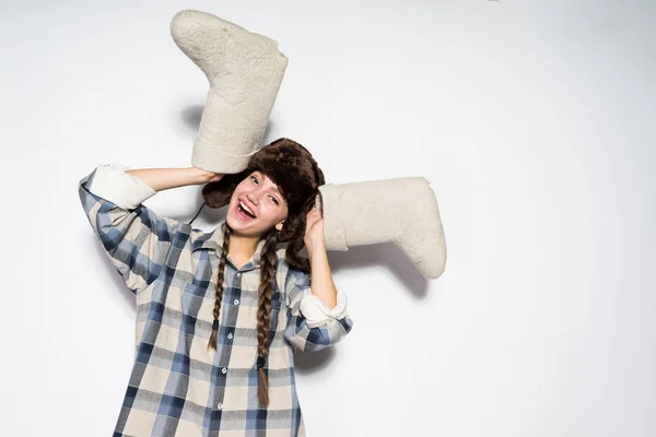 Girl in fur hat rejoices in winter, felt boots — Stock Photo, Image