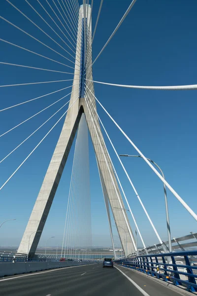 View of the suspension bridge supports from the track below them. — ストック写真