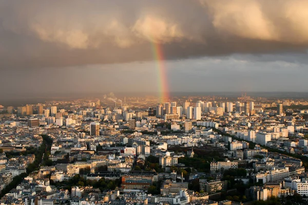 rainbow panorama of Paris, clouds. Top view of a European city, rainbow