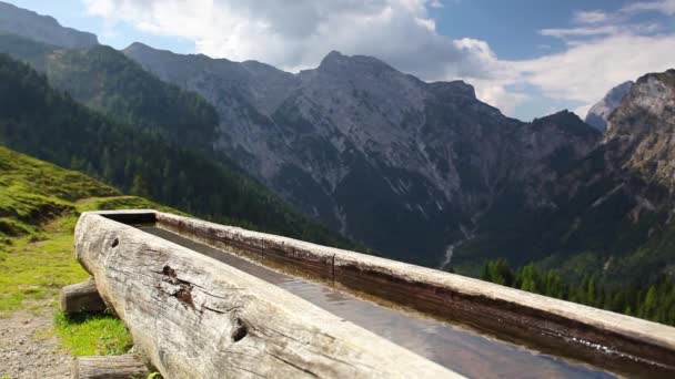 Rural scenery with wooden water well. — Stock Video