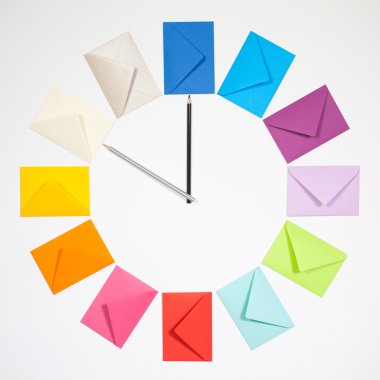 Clock of colored envelopes for Christmas mailing. clipart