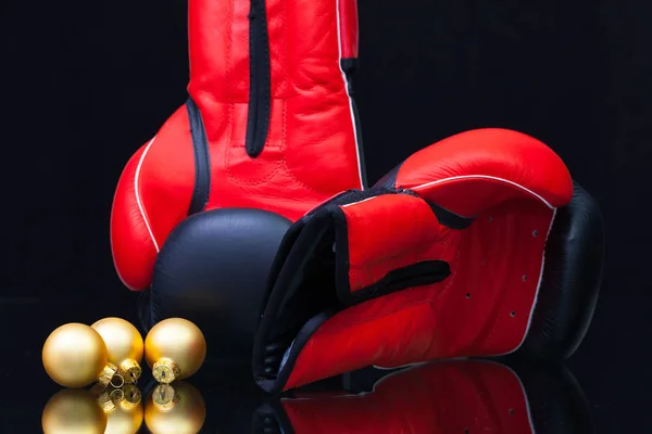 Red and black boxing gloves and Christmas decoration — Stock Photo, Image