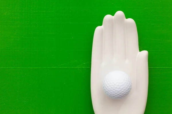 Detalhe da mão artifical com equipamentos de golfe — Fotografia de Stock