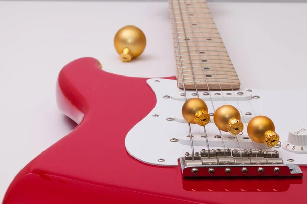 Red electric guitar and Christmas decoration