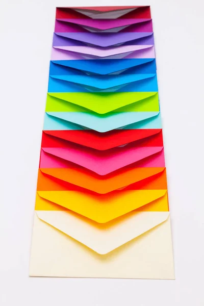 Different colored envelopes on the desk — Stock Photo, Image
