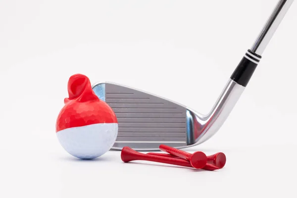 White golf ball with funny cap and golf club on the white backgr — Stock Photo, Image