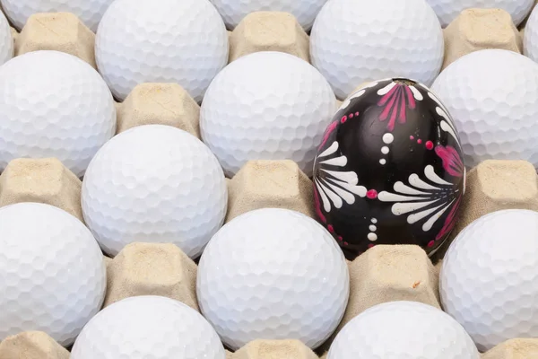 Golf balls in the box for eggs and Easter decoration — Stock Photo, Image
