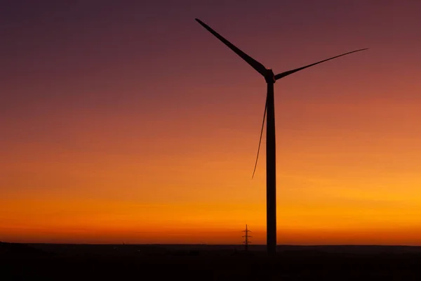 Windfarm at sunset and sky with dust from volcano — Stock Photo, Image