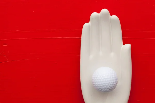 Detail van kunstmatige hand met golf apparatuur — Stockfoto