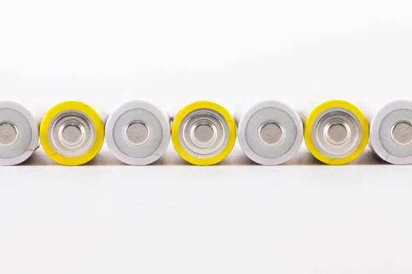 Energy abstract background of white and yellow  batteries. — Stock Photo, Image