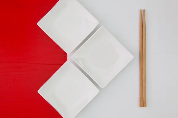 Ceramic bowls and bamboo chopsticks for sushi food — Stock Photo, Image