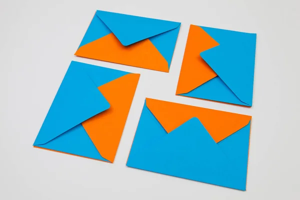 Different colored envelopes on the desk