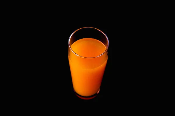Orange juice isolated on black background. — Stock Photo, Image