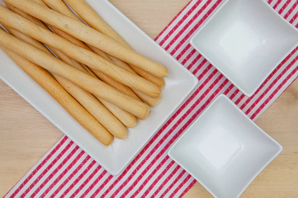 Typical Italian breadsticks with salt and olive oil — стокове фото