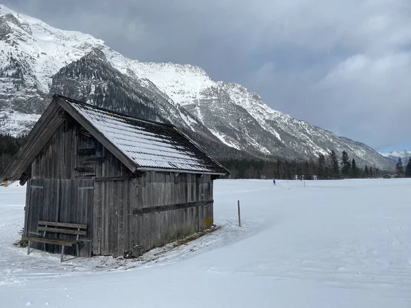 Winter mountains landscape with wooden barn Leutasch, Austria. — Stockfoto