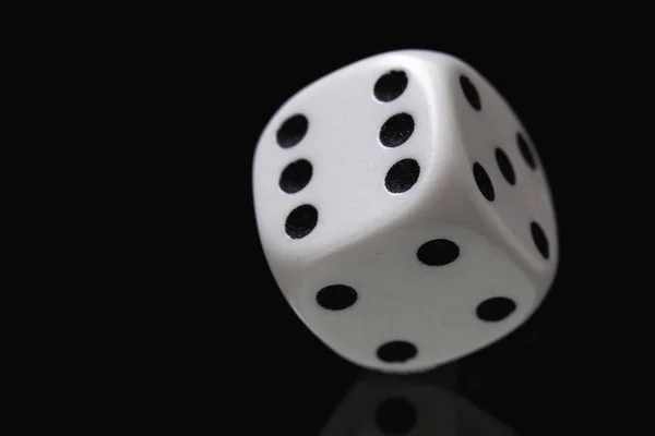 White dice on the black background. Playing dice at black  background. Playing a game with dice. Risk concept.