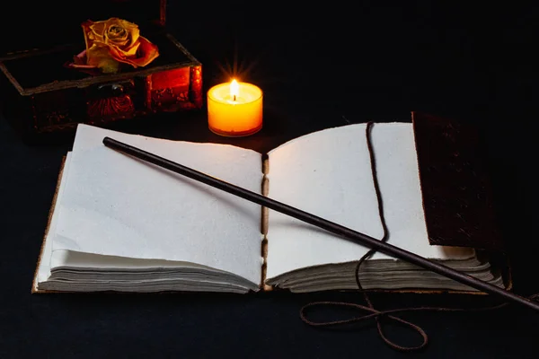 Image Open Magic Book Wand Burning Candle Dry Rose Table — Stock Photo, Image
