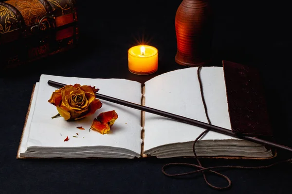 Image Open Magic Book Wand Burning Candle Dry Rose Table — Stock Photo, Image