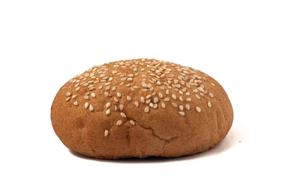 Hamburger bun with sesame seeds isolated on a white background — Stock Photo, Image